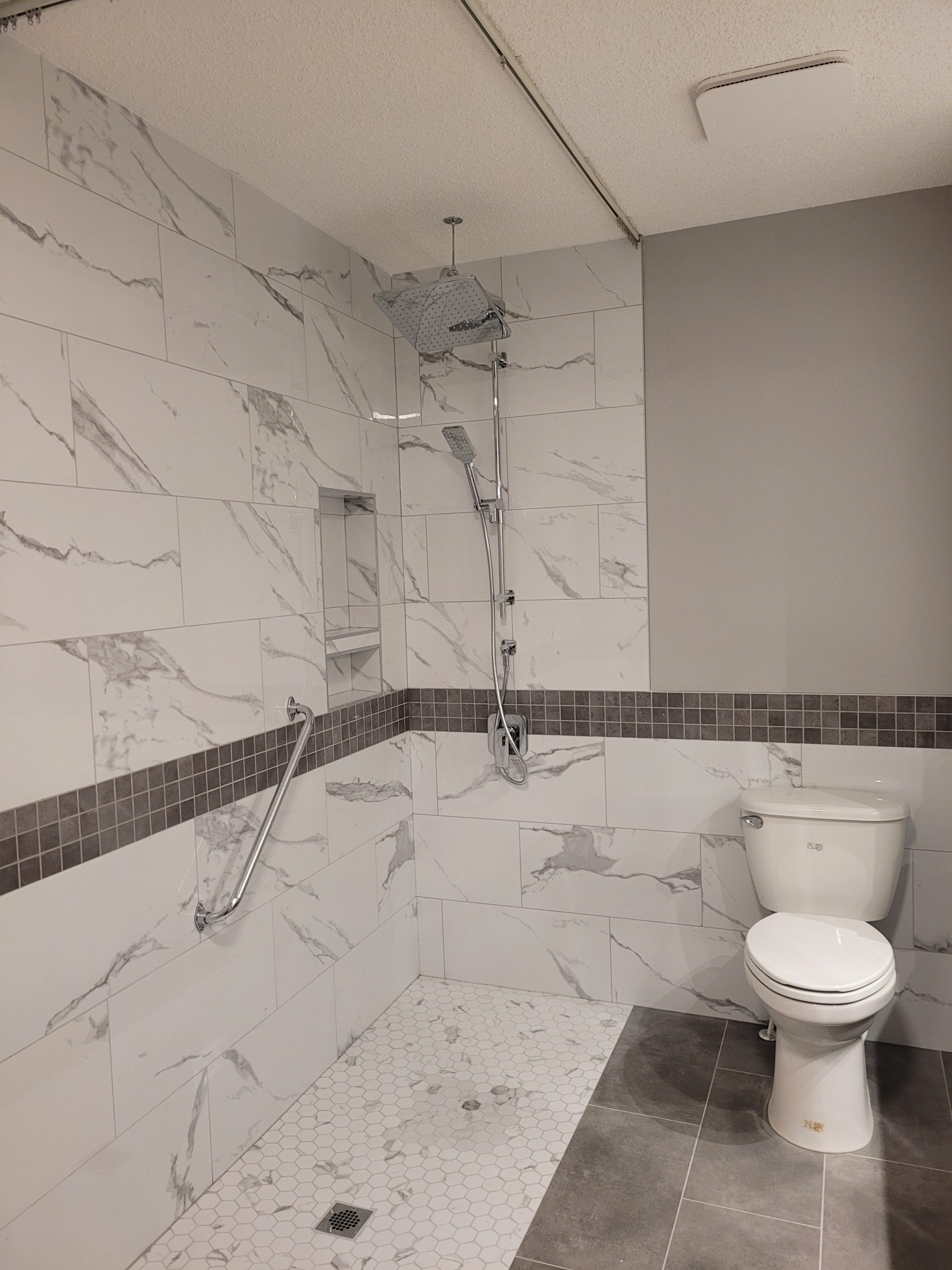 Walk‑in shower with wood vanity