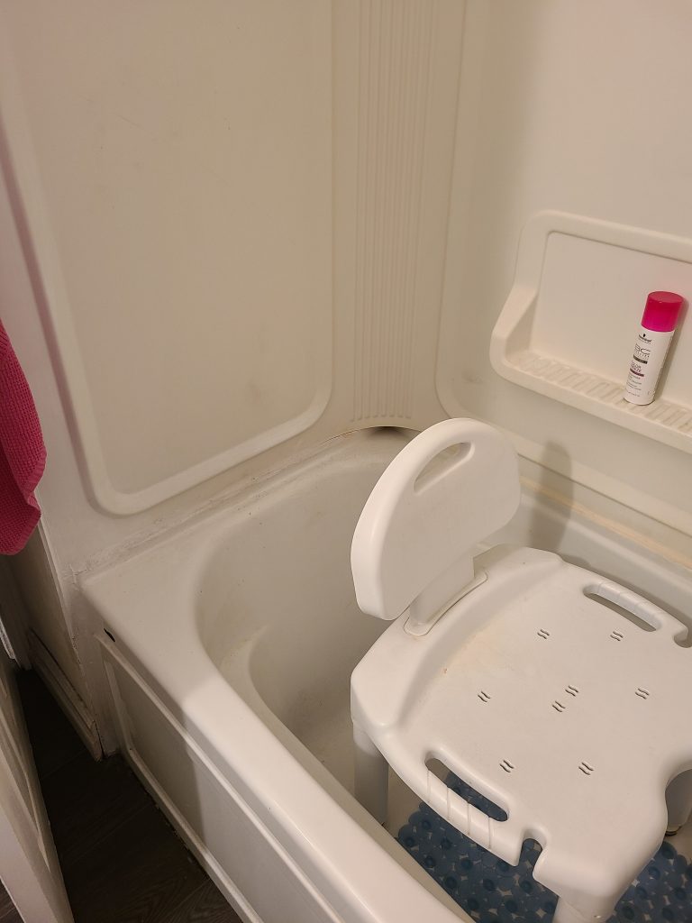 Before: bathtub with a portable bath seat