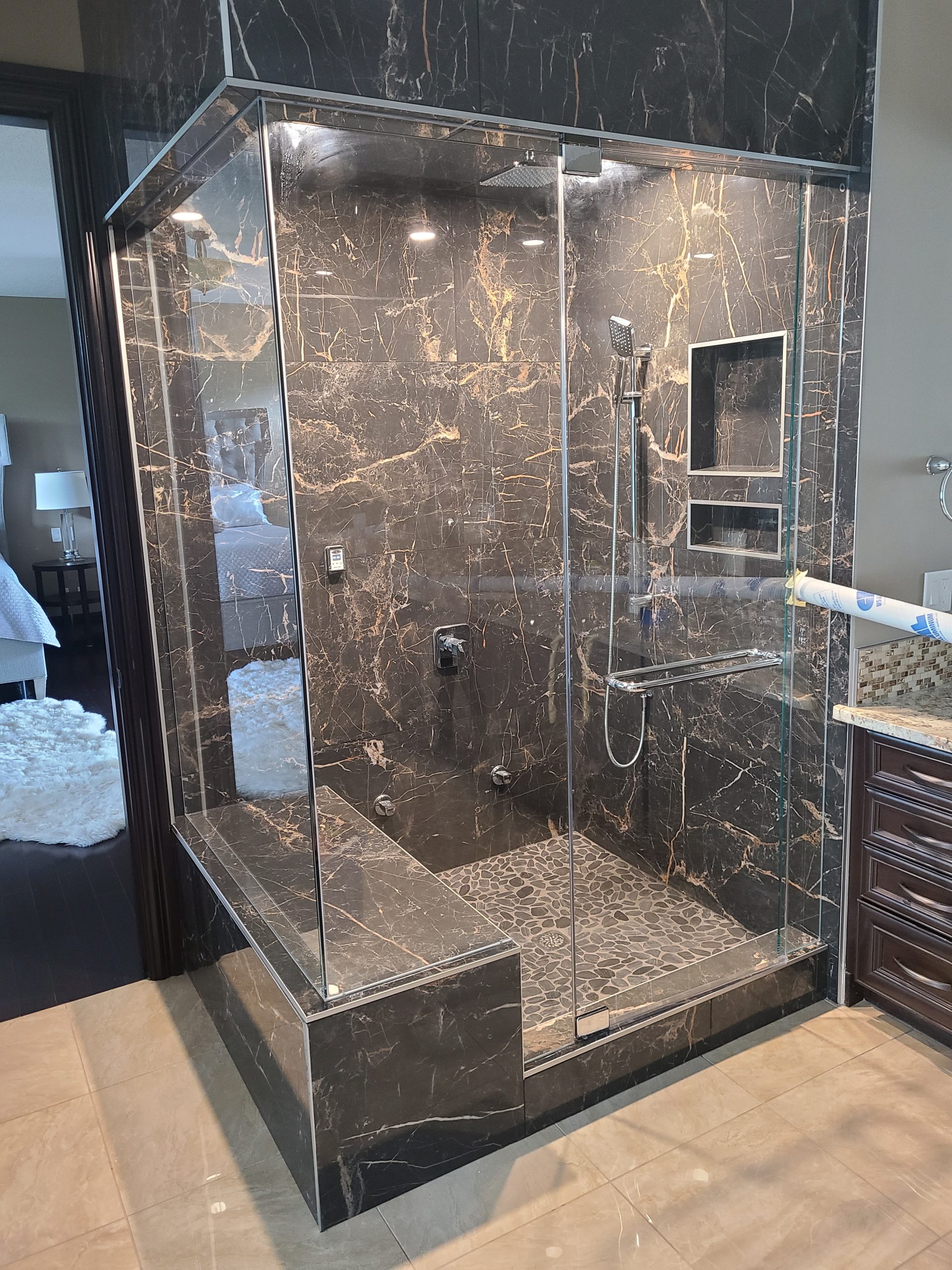 Dark‑tile walk‑in shower
